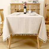 AIMHave modern large windowpane plaid linen look tablecloth featuring oversized coffee brown and white checks with tassels on a rustic table