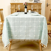 AIMHave vintage blue floral linen look tablecloth featuring elegant white blossoms with white tassels on a dining table