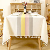 Aimhave modern geometric block linen look tablecloth featuring pastel yellow pink and grey shapes with white tassels on a dining table