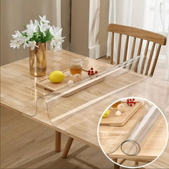 Clear PVC table protector protecting a wooden dining table