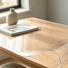 Close-up of PVC desk pad being bent, highlighting its high-quality flexibility and durable structure.
