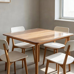 42x42 inch clear PVC table protector on a 4-person dining table, waterproof and heat resistant furniture guard.