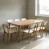 Clear PVC table protector on a large 8-person dining table for surface protection.