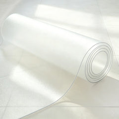 A rolled frosted PVC laundry mat, highlighting easy storage and the translucent matte texture.
