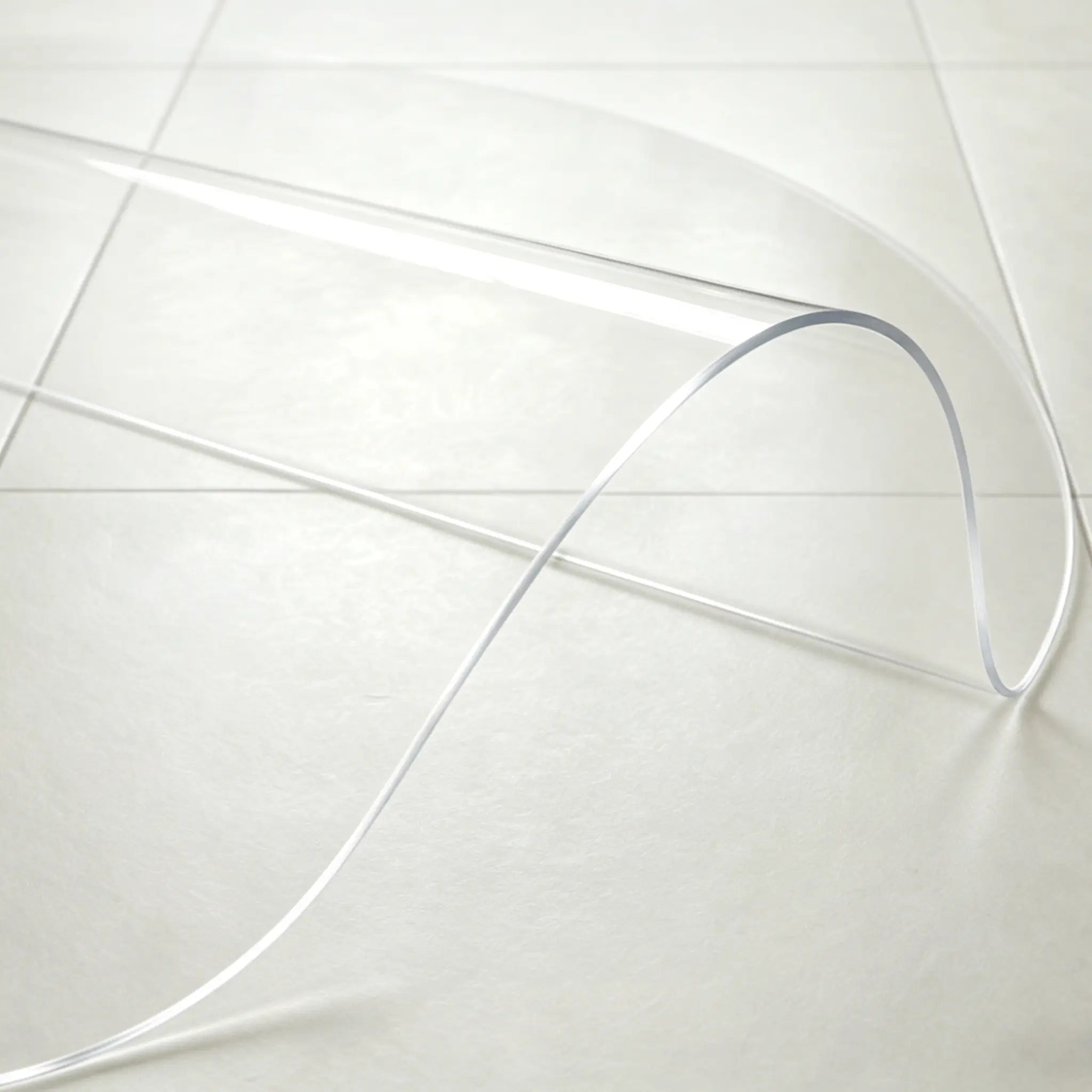 Close-up of round PVC mat being bent, showing 1.5mm flexible and durable material for long-lasting entryway use.