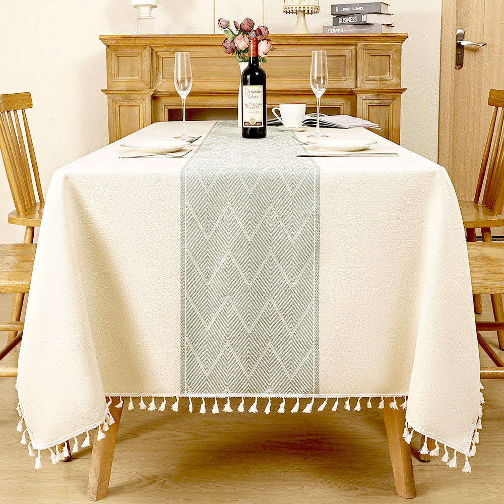 Top view of AIMHave modern southwestern boho dark red poly-cotton tablecloth styled with plates and croissants