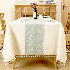 Top view of AIMHave modern southwestern boho dark red poly-cotton tablecloth styled with plates and croissants