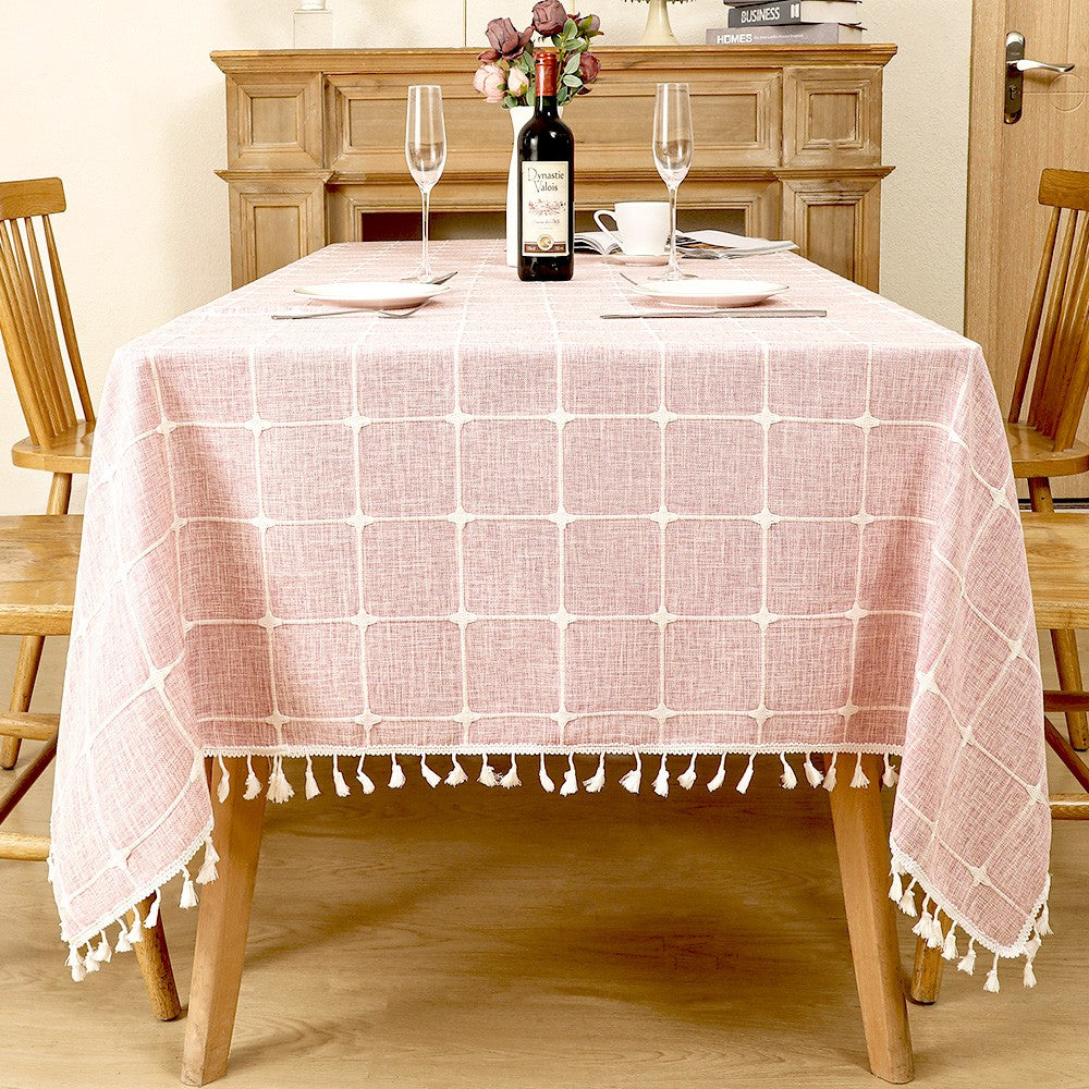 AIMHave vintage pink floral linen look tablecloth featuring elegant white blossoms with white tassels on a rustic table