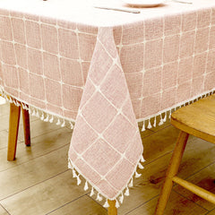 Close-up of elegant white macrame fringe tassels on an AIMHave pink country garden floral faux linen tablecloth