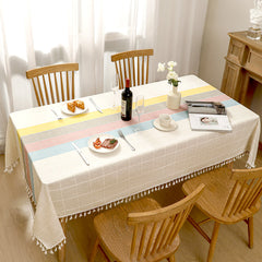 Top view of AIMHave luxury abstract fluid wave patchwork colorful poly-cotton tablecloth styled with plates and croissants