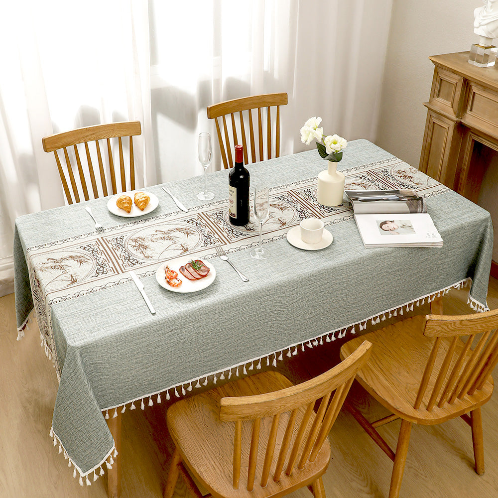 AIMHave mid-century modern geometric block linen look tablecloth featuring retro navy blue and oatmeal shapes with tassels on a dining table
