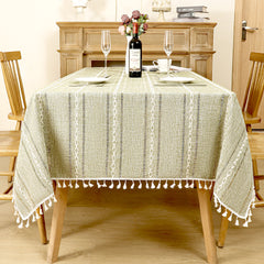 AIMHave modern vertical stripe linen look tablecloth featuring multi-width green and white lines with tassels on a dining table