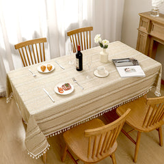 Top view of AIMHave elegant minimalist linear coffee brown poly-cotton tablecloth styled with plates and croissants
