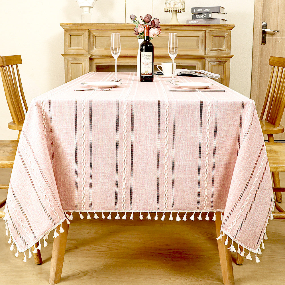 AIMHave modern vertical stripe linen look tablecloth featuring multi-width pink and white lines with tassels on a dining table