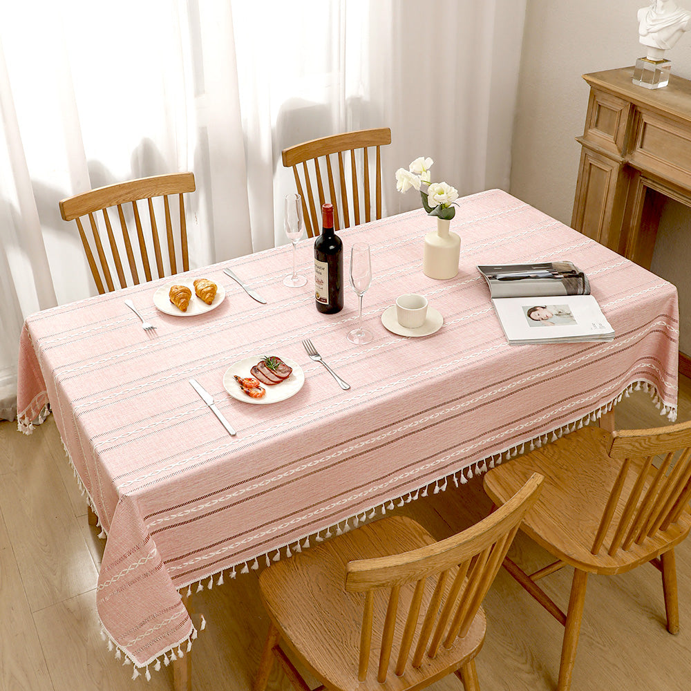 Top view of AIMHave elegant minimalist linear pink poly-cotton tablecloth styled with plates and croissants