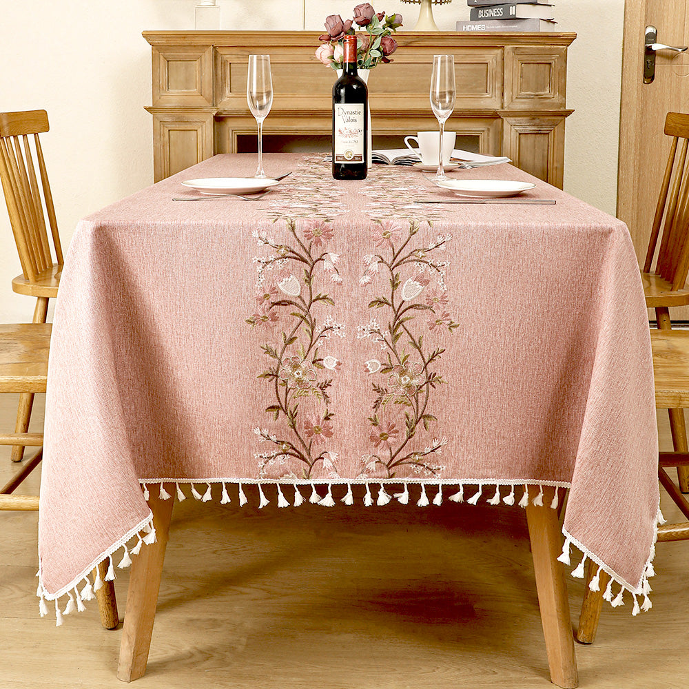 AIMHave romantic cottagecore tablecloth featuring embroidered wildflower and botanical bouquets down the center of a dusty rose dining table