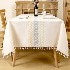 AIMHave modern farmhouse tablecloth featuring woven yellow, blue, and green wheat ear stripes down the center of an oatmeal dining table