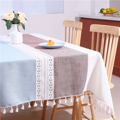 Bright and modern dining room table styled with an AIMHave contemporary abstract blue and purple tablecloth featuring a flower vase