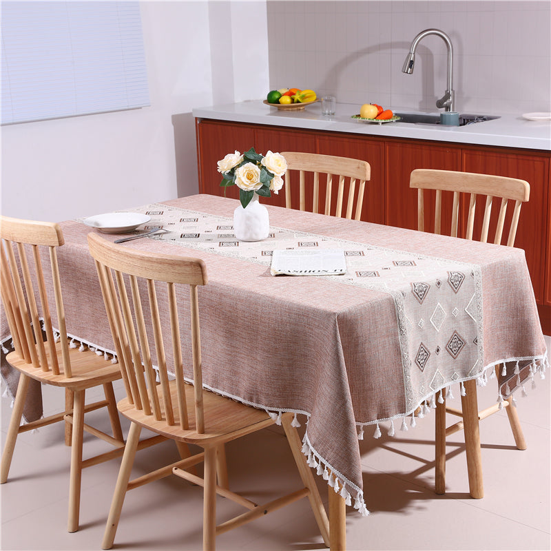 Bright and modern dining room table styled with an AIMHave contemporary abstract coffee brown wave tablecloth featuring a flower vase