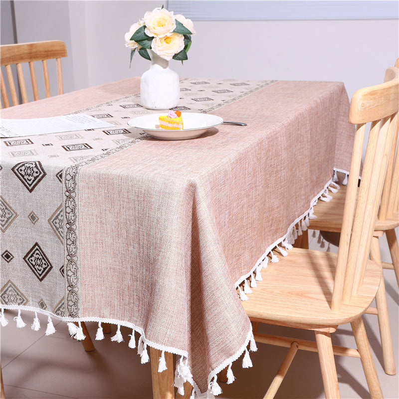 Bright and modern dining room table styled with an AIMHave contemporary abstract coffee brown wave tablecloth featuring a flower vase