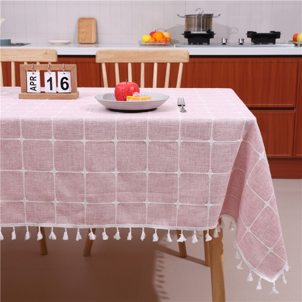 Cozy sunlit dining room table styled with an AIMHave vintage pink floral tablecloth featuring white tassels and a flower vase