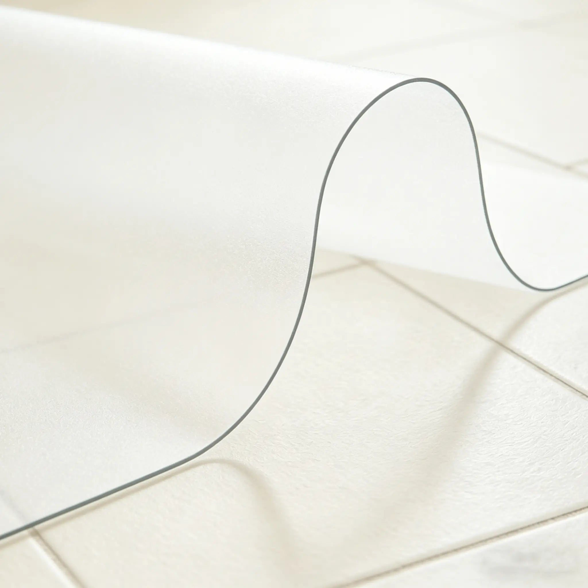 Frosted PVC mat for entryway showing 1.5mm material flexibility and durable matte finish for floor protection.