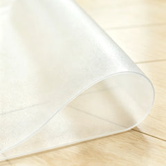 Close-up of frosted PVC mat being folded to demonstrate high flexibility and non-toxic, pet-friendly quality.