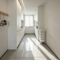 Heavy-duty PVC floor mat used as a waterproof runner in a modern kitchen hallway.