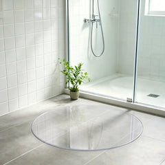 Round clear PVC bathroom mat, waterproof and non-slip floor protector for shower, bath, and vanity areas.