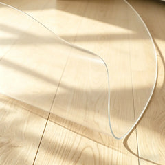 Circular PVC mat with edge folded to demonstrate flexibility and smooth, non-sharp rounded edges.
