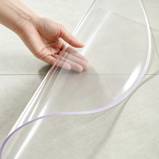 Round clear PVC entry mat with edge folded to show high flexibility and smooth, non-slip rounded edges.